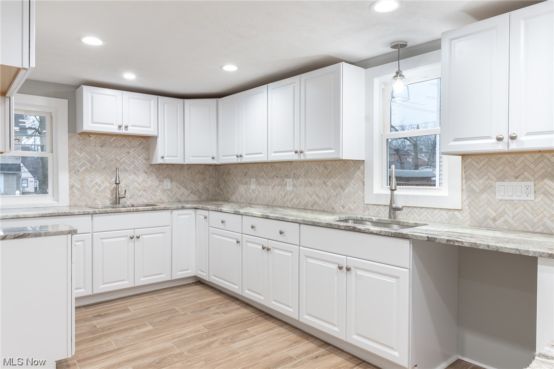 3517 Bainbridge Road Cleveland Heights, OH 44118 - Photo 11 of 35 Kitchen featuring white cabinetry and a wealth of natural light