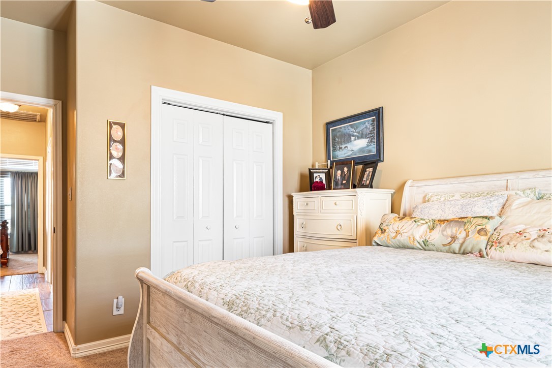 790 Spanish Grant Road Goliad, TX 77963 - Photo 25 of 41 a bedroom with a bed and a dresser