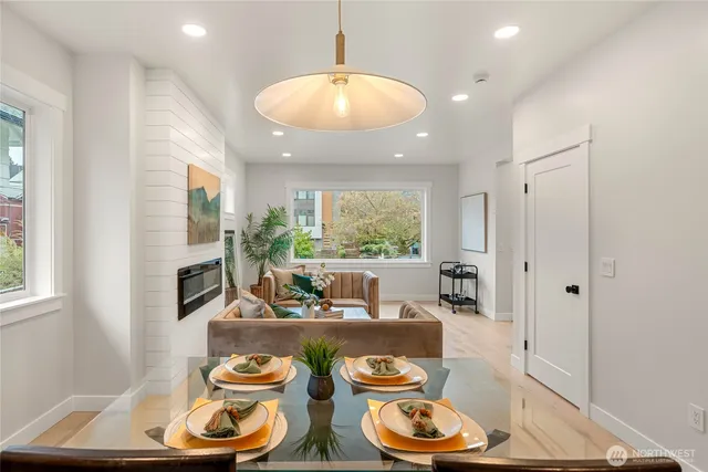 a living room with dining table and chairs