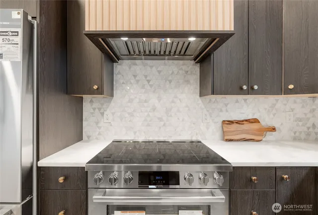 an oven with granite countertop a stove and a sink