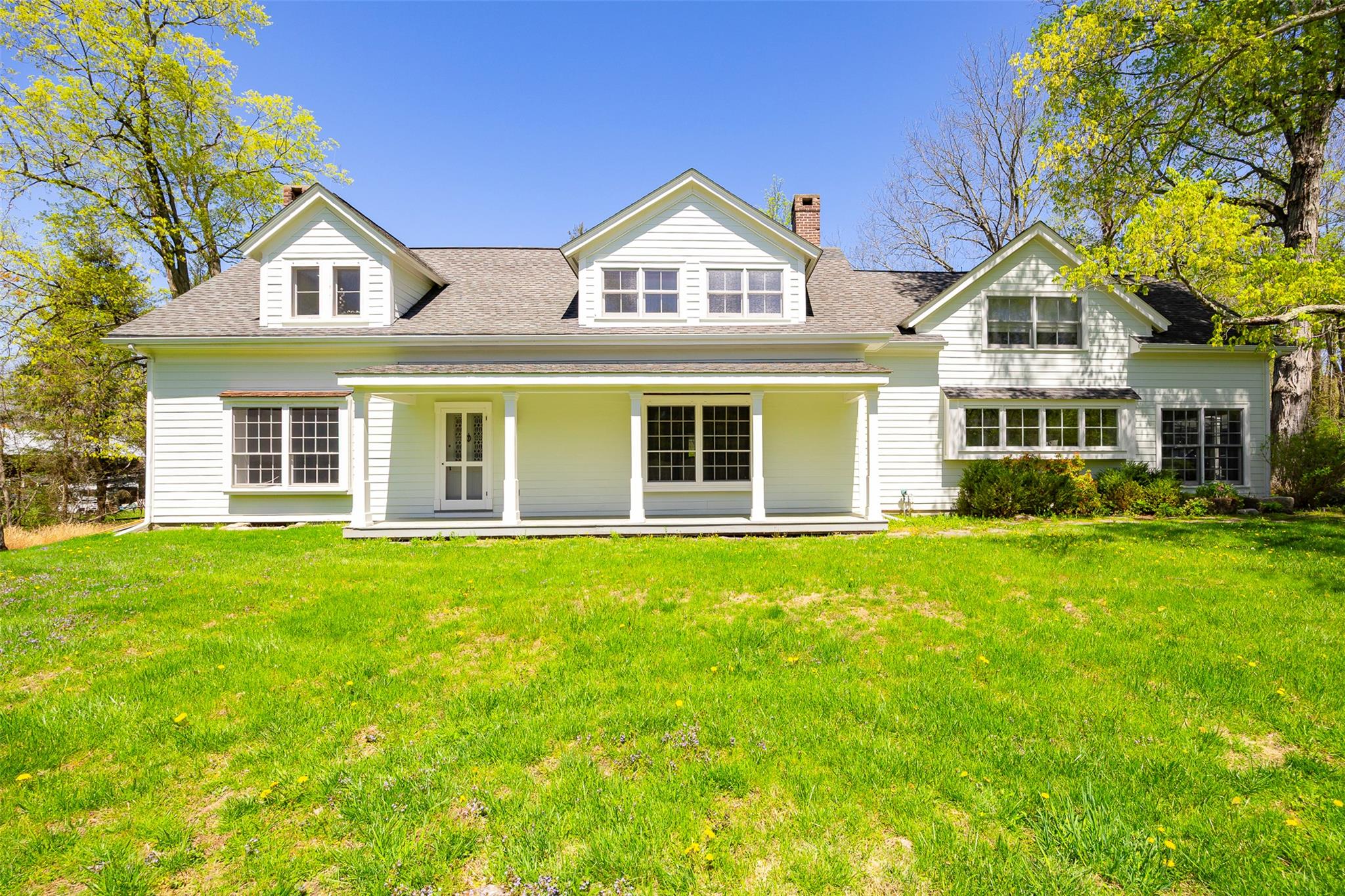 front view of a house with a yard