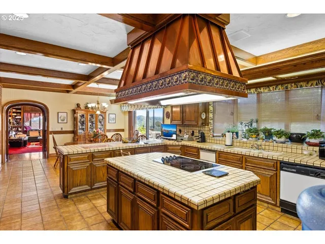 a bedroom with a large bed and a large window