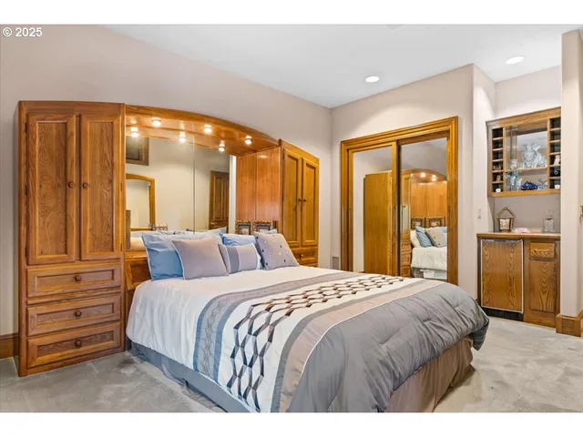 a bathroom with a sink a mirror and a shower