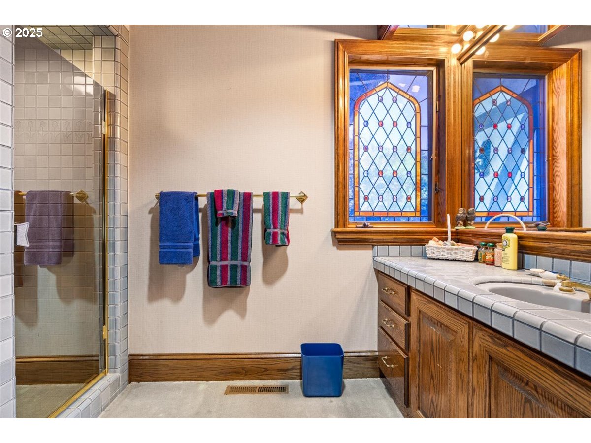 331 Metz Hill Road Oakland, OR 97462 - Photo 33 of 47 a bathroom with a sink and a mirror