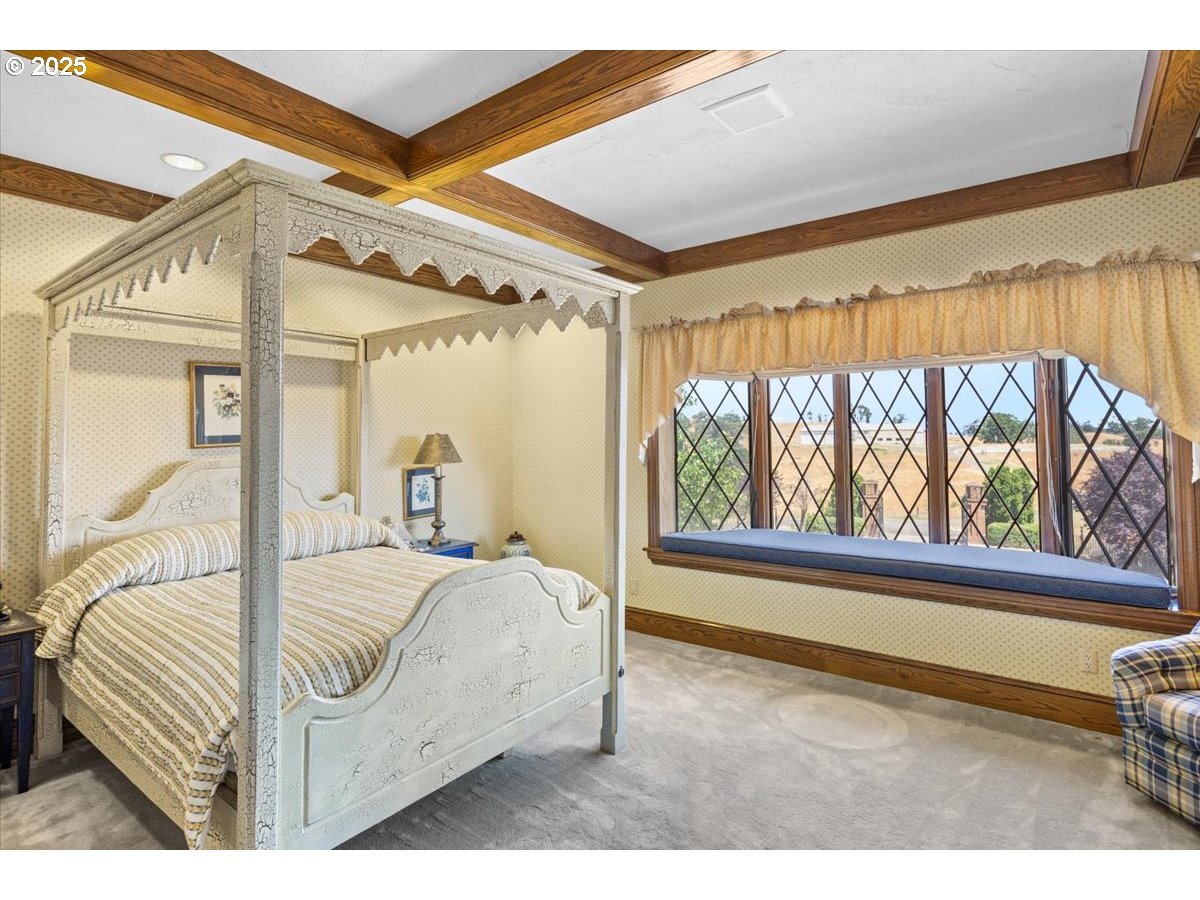 331 Metz Hill Road Oakland, OR 97462 - Photo 34 of 47 a bed sitting in a bedroom next to a window