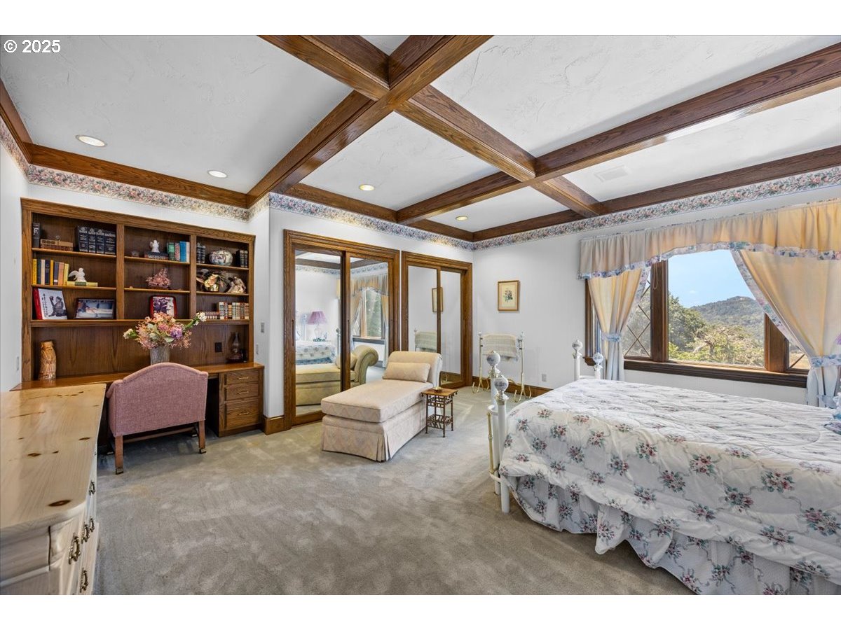 331 Metz Hill Road Oakland, OR 97462 - Photo 35 of 47 a bedroom with furniture and large window