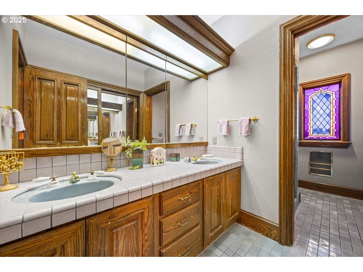 331 Metz Hill Road Oakland, OR 97462 - Photo 36 of 47 a bathroom with a sink a mirror and a shower