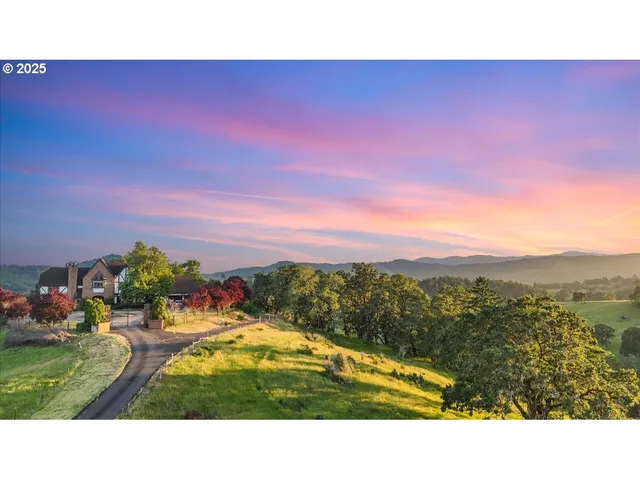 a open area with mountains in the background