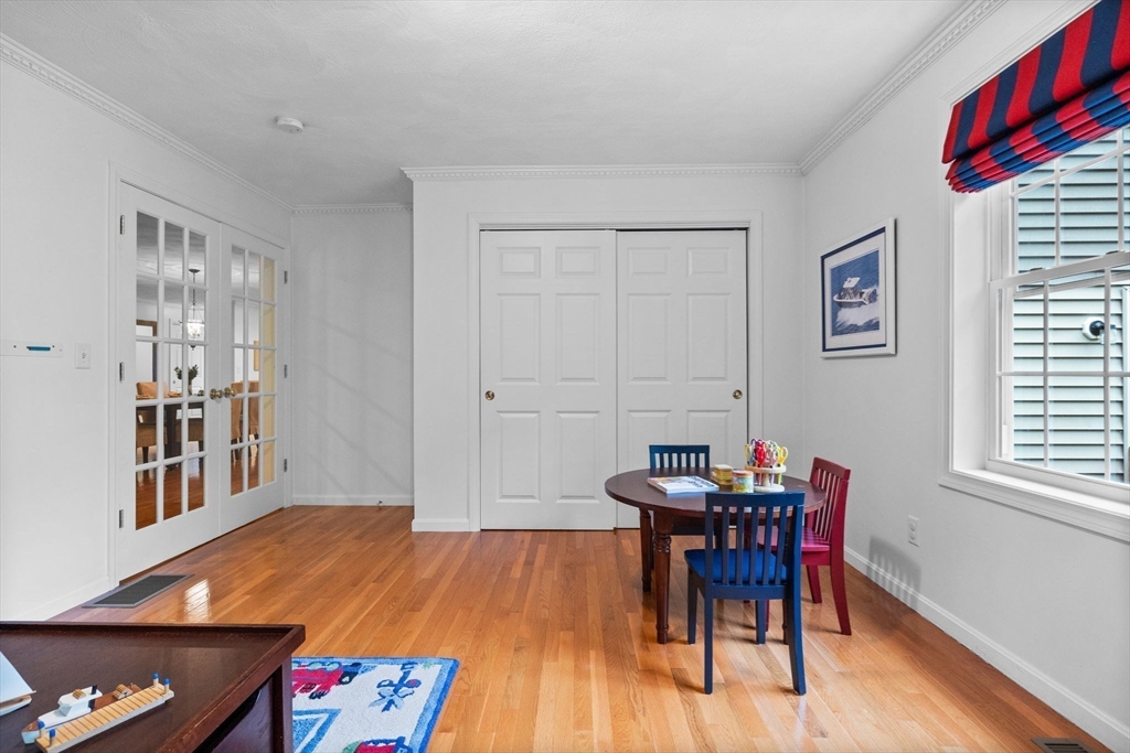 18 Dale Street, Unit 7A Andover, MA 01810 - Photo 16 of 34 a view of a dining room with furniture and wooden floor