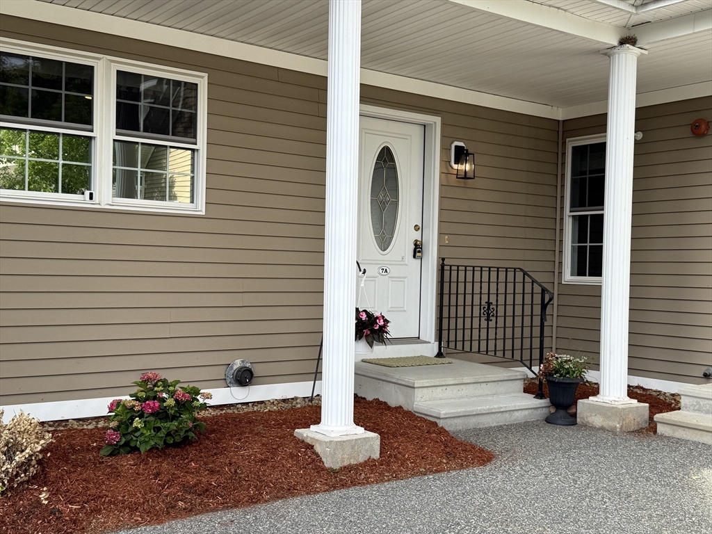 18 Dale Street, Unit 7A Andover, MA 01810 - Photo 2 of 34 a front view of a house with a yard