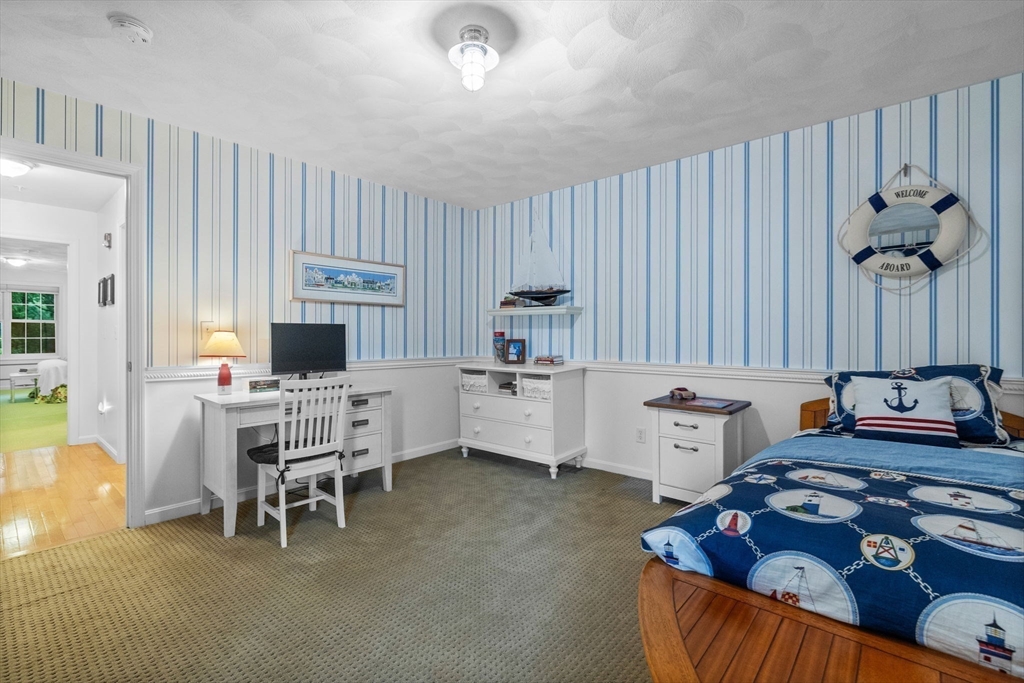 18 Dale Street, Unit 7A Andover, MA 01810 - Photo 24 of 34 a living room with furniture and a flat screen tv