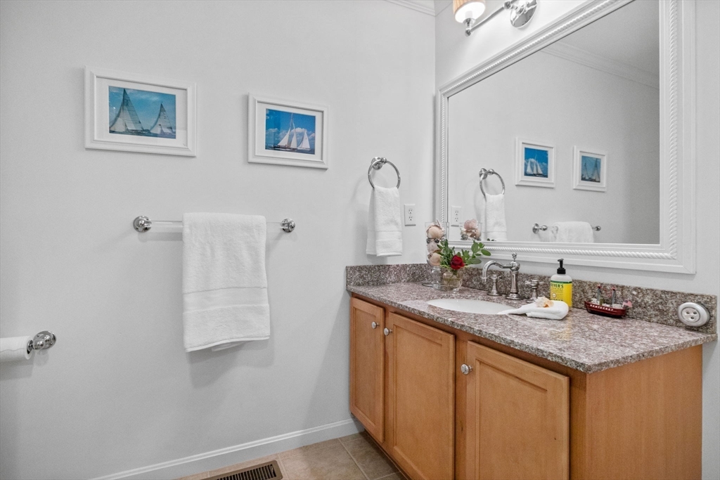 18 Dale Street, Unit 7A Andover, MA 01810 - Photo 26 of 34 a bathroom with a granite countertop sink and a mirror