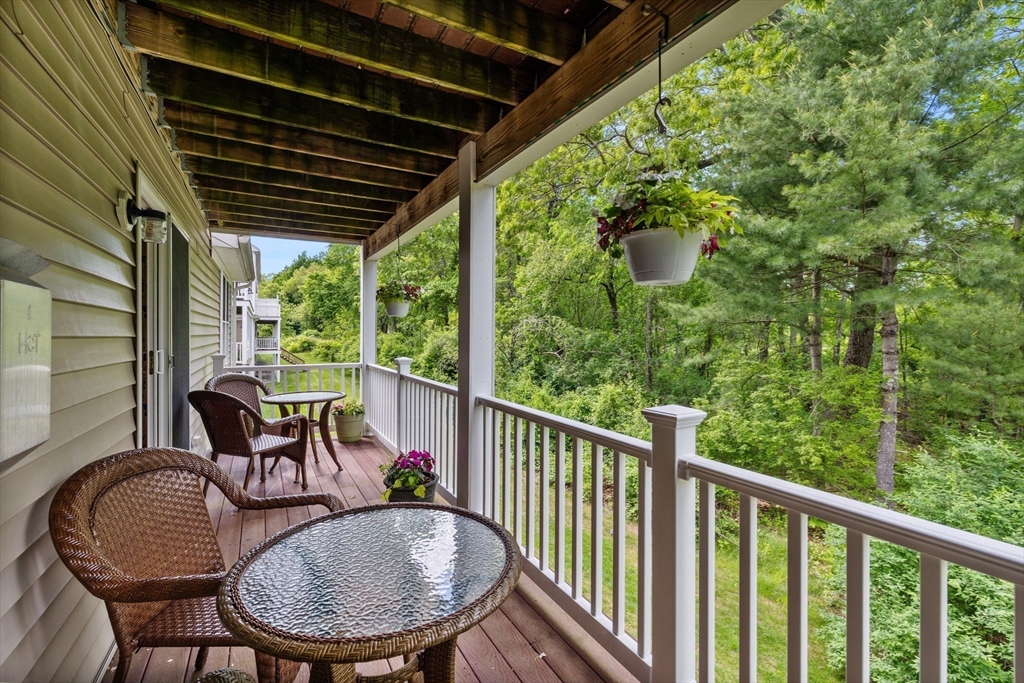 18 Dale Street, Unit 7A Andover, MA 01810 - Photo 33 of 34 a view of a porch with furniture and a yard