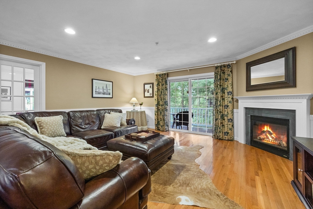 18 Dale Street, Unit 7A Andover, MA 01810 - Photo 4 of 34 a living room with furniture and a fireplace