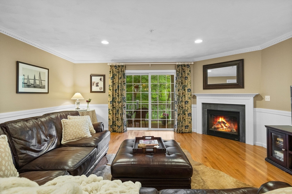 18 Dale Street, Unit 7A Andover, MA 01810 - Photo 6 of 34 a living room with furniture and a fireplace