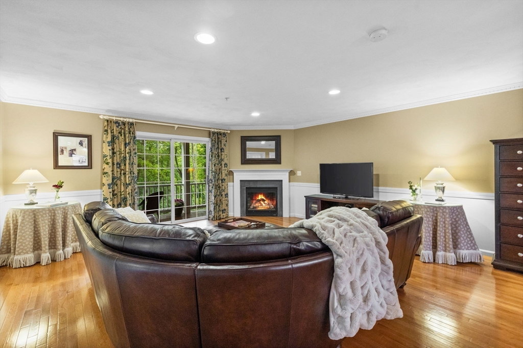 18 Dale Street, Unit 7A Andover, MA 01810 - Photo 7 of 34 a living room with furniture and a fireplace
