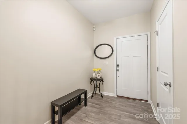 a view of a livingroom with wooden floor