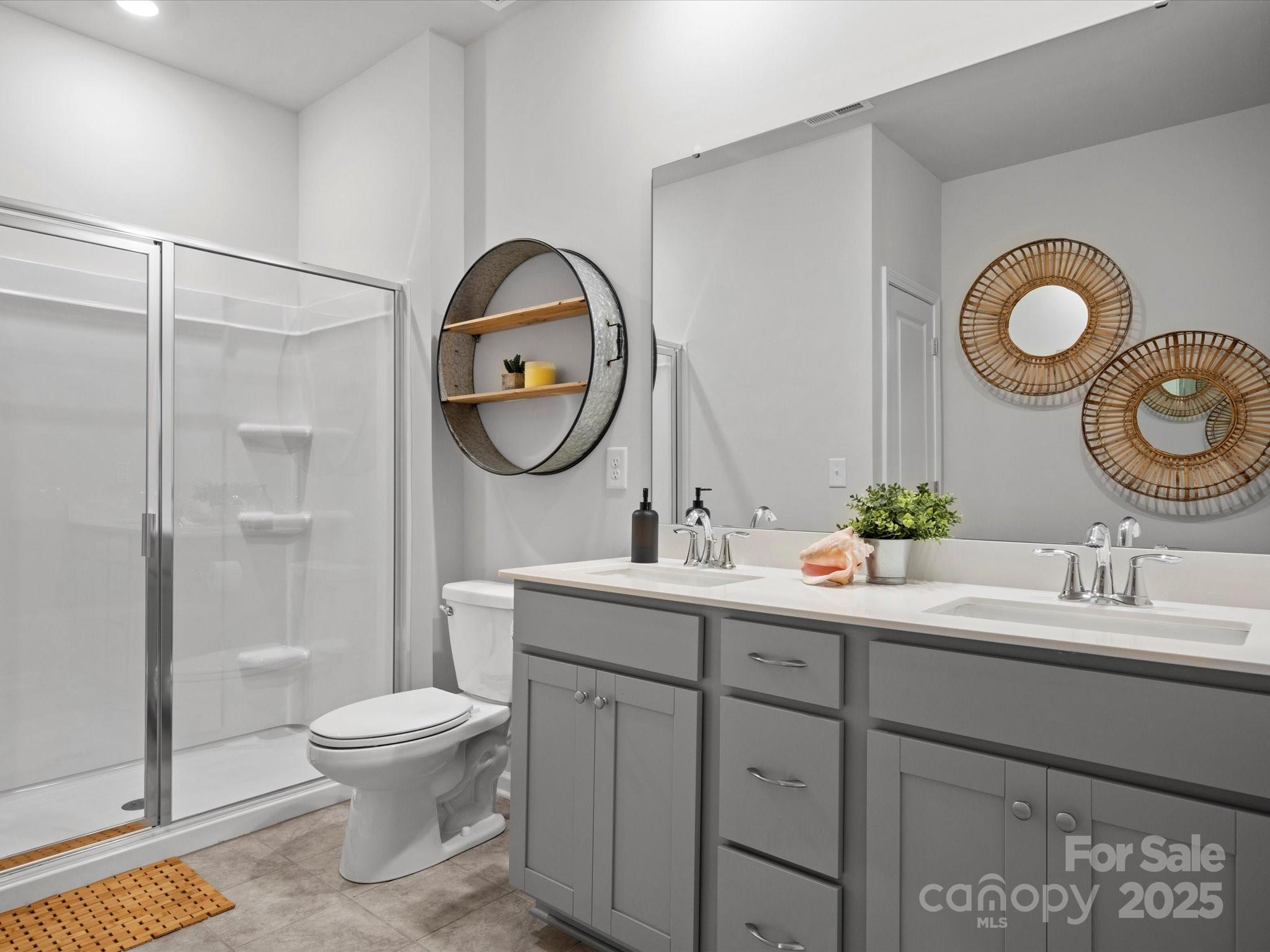 5581 Soft Shell Drive Lancaster, SC 29720 - Photo 22 of 48 a bathroom with a toilet sink and mirror