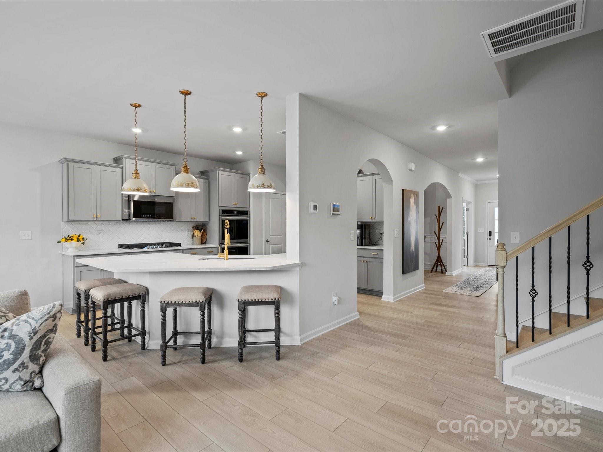 5581 Soft Shell Drive Lancaster, SC 29720 - Photo 23 of 48 a large white kitchen with lots of counter space and appliances