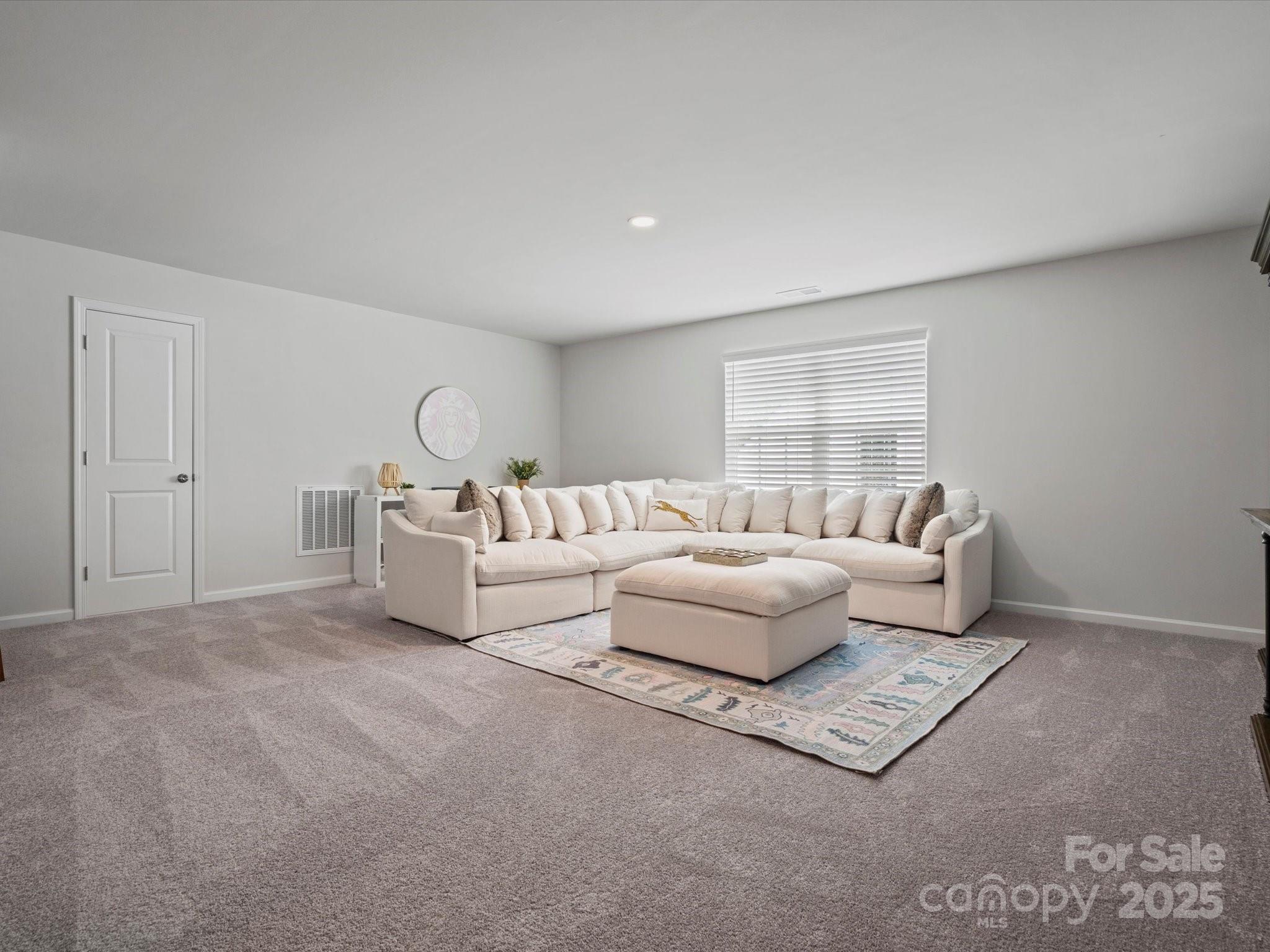 5581 Soft Shell Drive Lancaster, SC 29720 - Photo 39 of 48 a living room with furniture and a large window