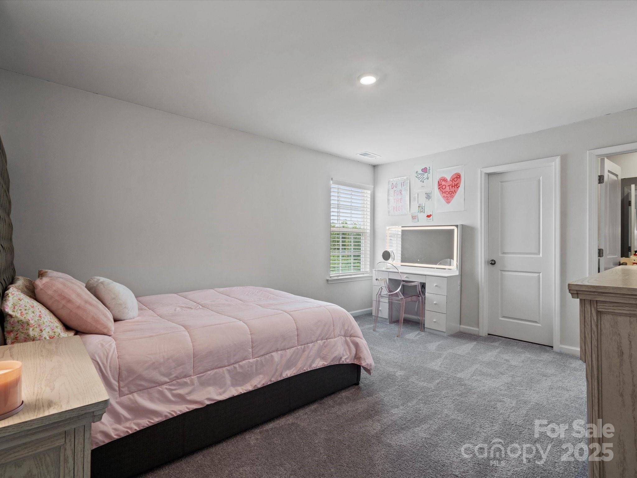 5581 Soft Shell Drive Lancaster, SC 29720 - Photo 41 of 48 a bedroom with a bed and a desk