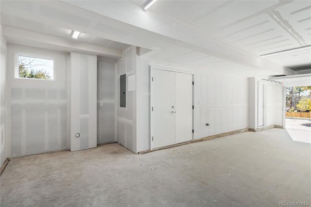 a view of an empty room and a window