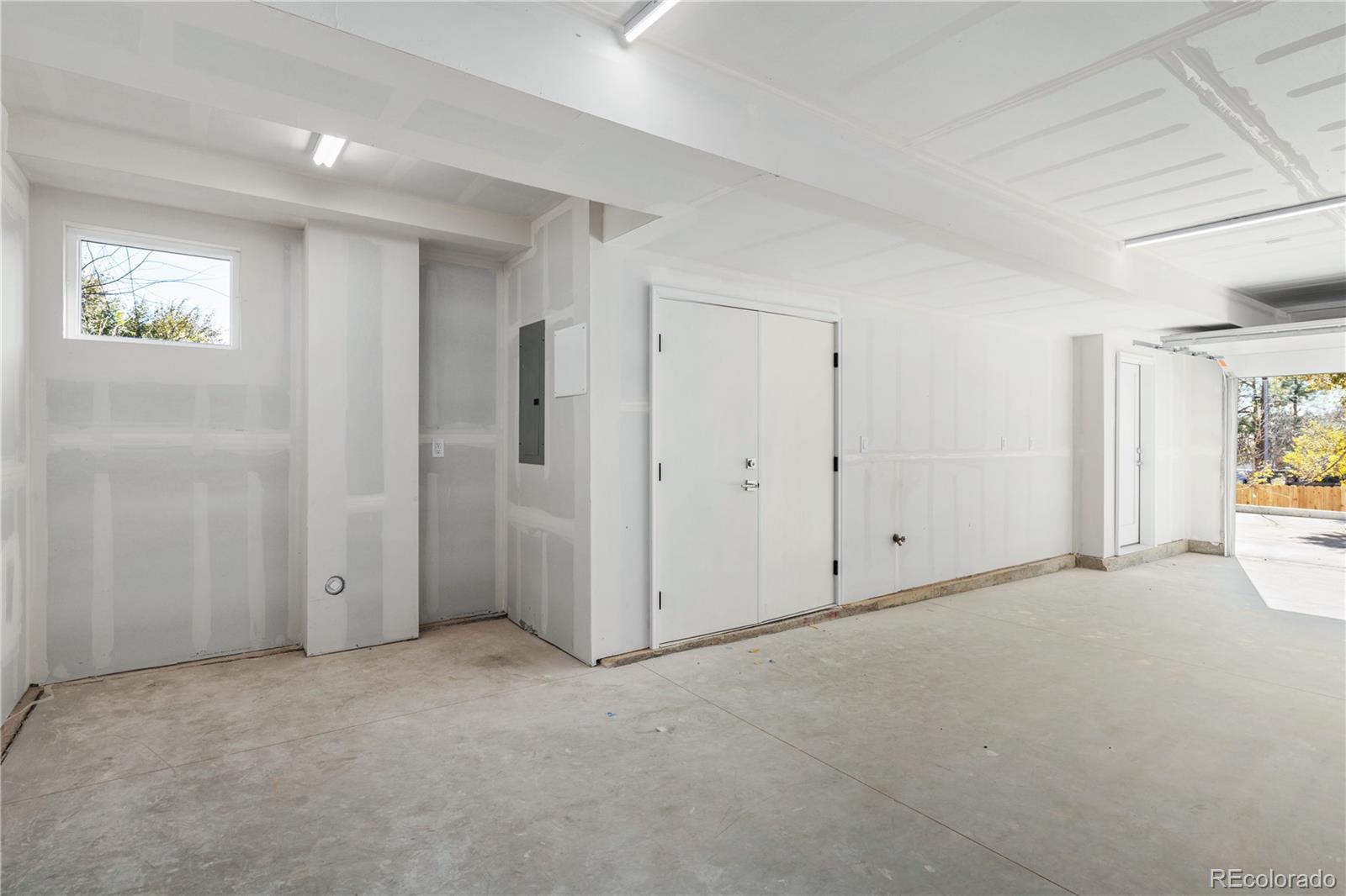 1686 Tabor Street Lakewood, CO 80215 - Photo 24 of 34 a view of an empty room and a window