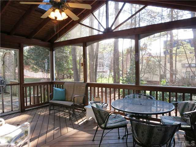 2613 Bembridge Drive Raleigh, NC 27613 - Photo 22 of 25 Outside, the lg Deck off the Living Rm accesses the lg Screened Porch w/CF & 4 skylights! Screened Porch