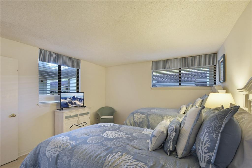 201 Neptune Road, Unit 157 St. Simons Island, GA 31522 - Photo 20 of 29 Guest bedroom