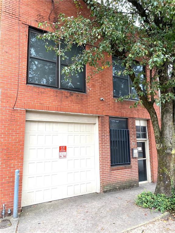 136 Walker Street Southwest Atlanta, GA 30313 - Photo 2 of 28 a view of entrance gate of the house