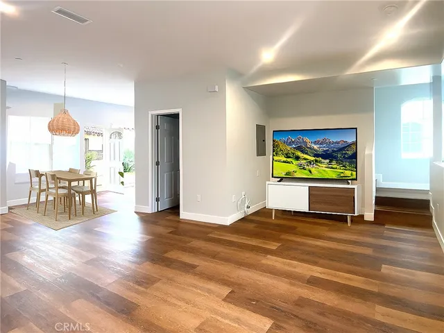 a view of kitchen with furniture and wooden floor