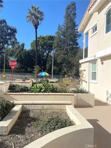 a view of a yard with cars