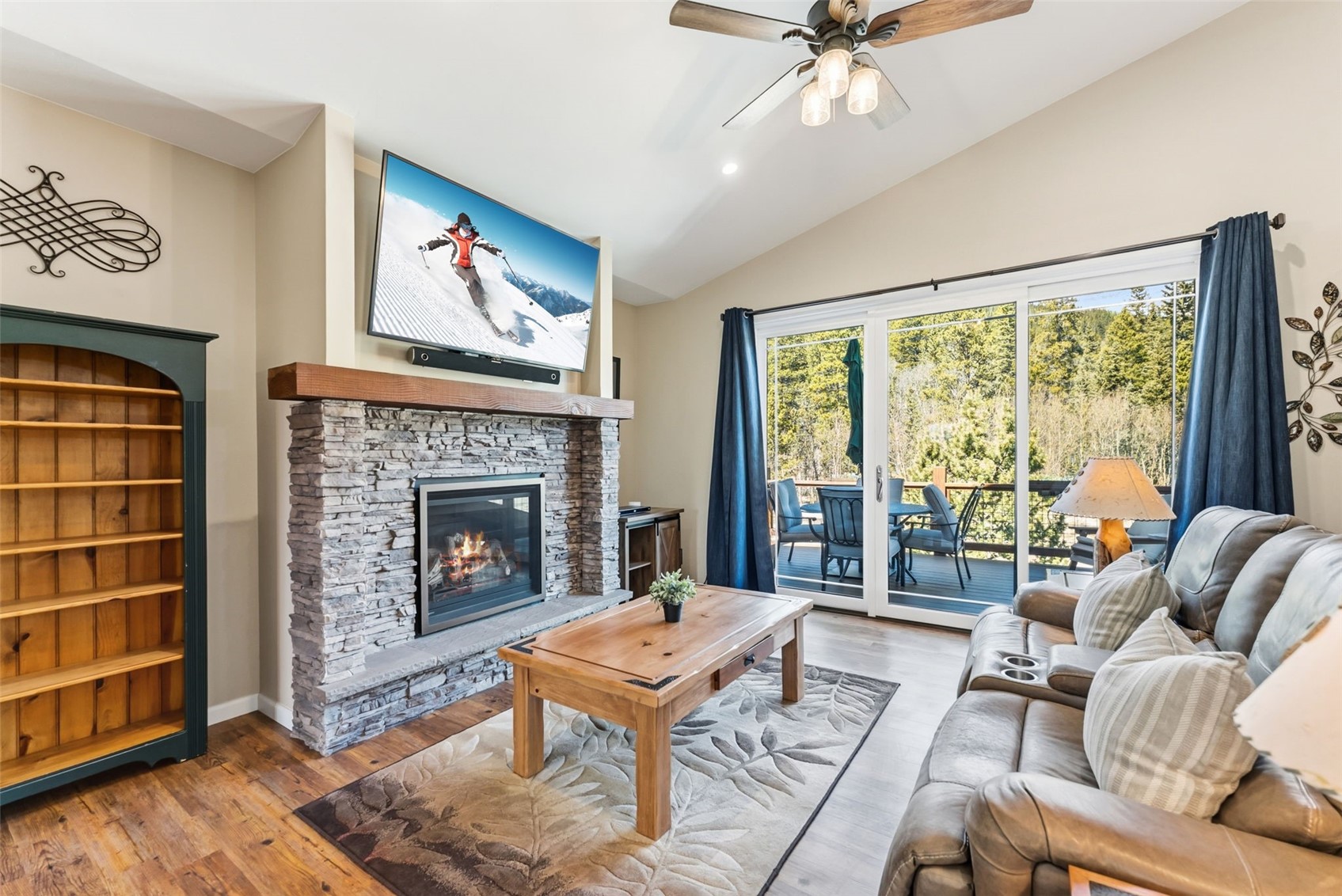 1227 Edgewood Road Alma, CO 80420 - Photo 24 of 40 a living room with furniture a fireplace and a large window