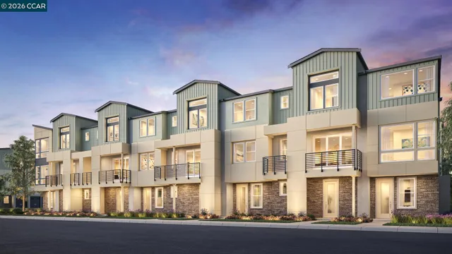 a front view of a residential apartment building with a yard