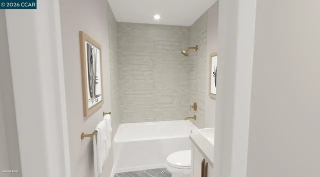a bathroom with a toilet and a bathtub