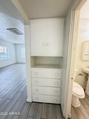 a bathroom with a vanity and a toilet