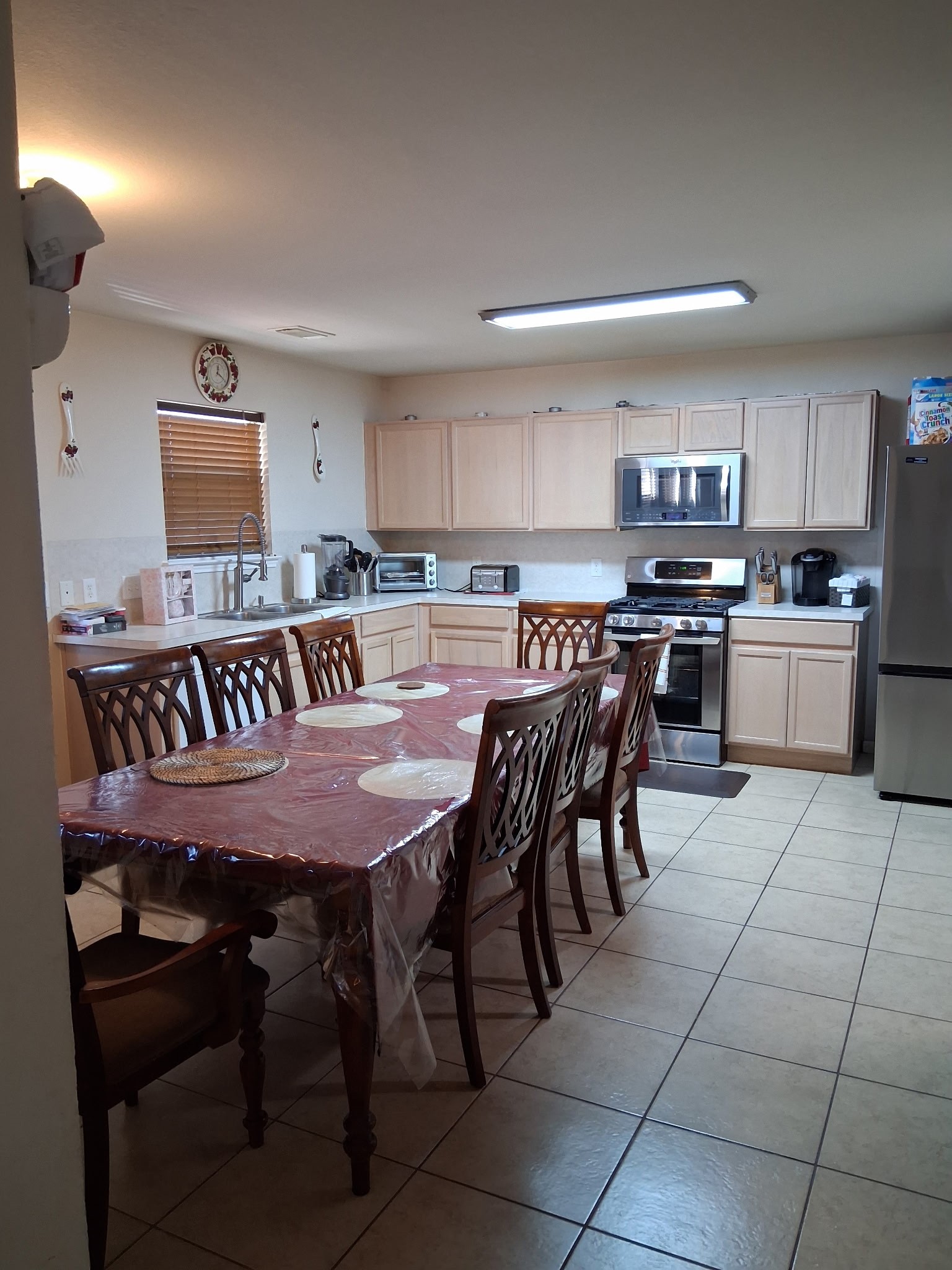 9607 Rads Point Sugar Land, TX 77498 - Photo 21 of 24 a large kitchen with a table and chairs in it