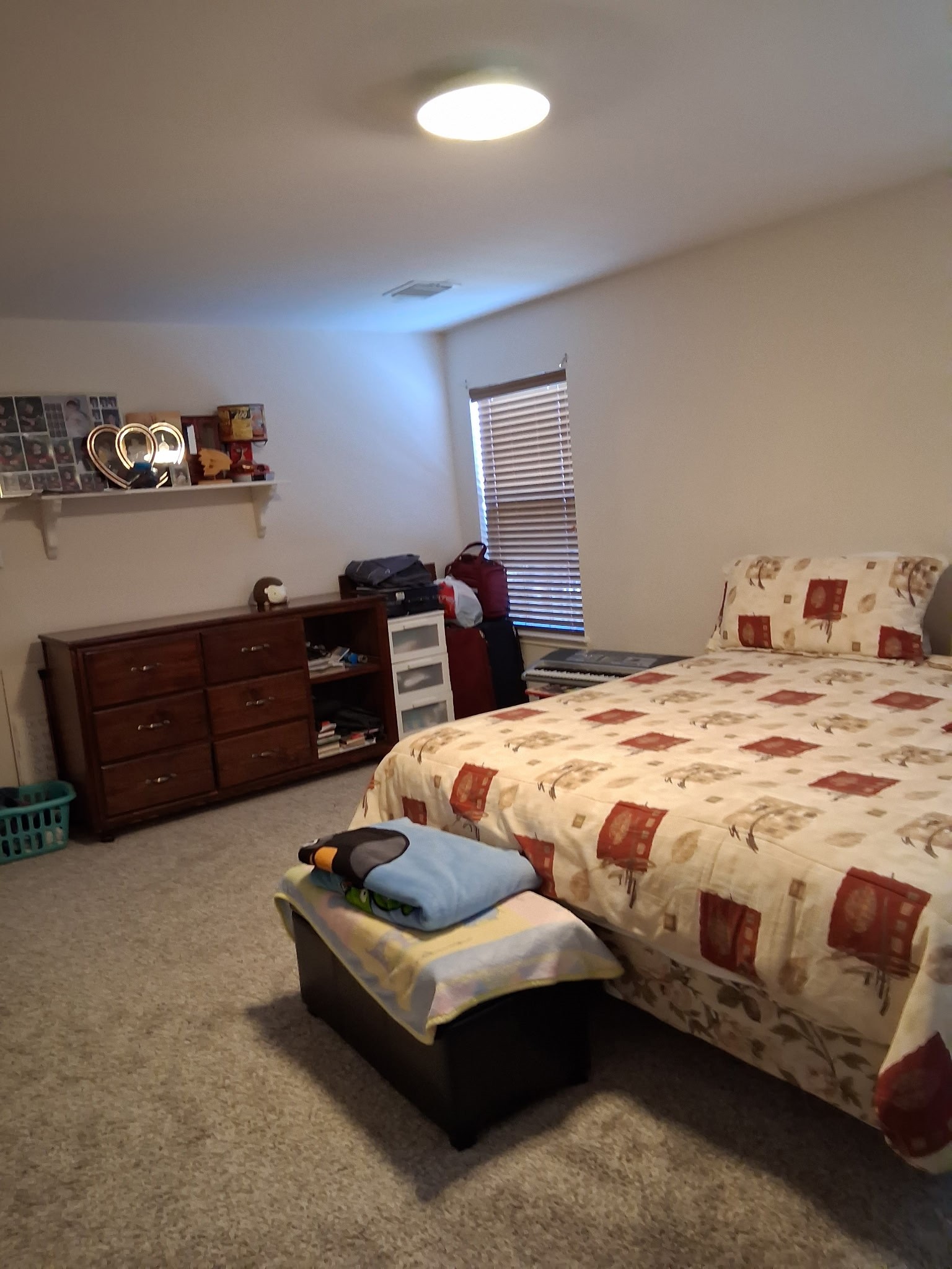 9607 Rads Point Sugar Land, TX 77498 - Photo 7 of 24 a bedroom with a bed and dresser