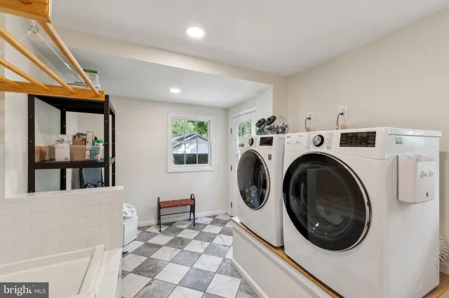 a utility room with dryer and washer
