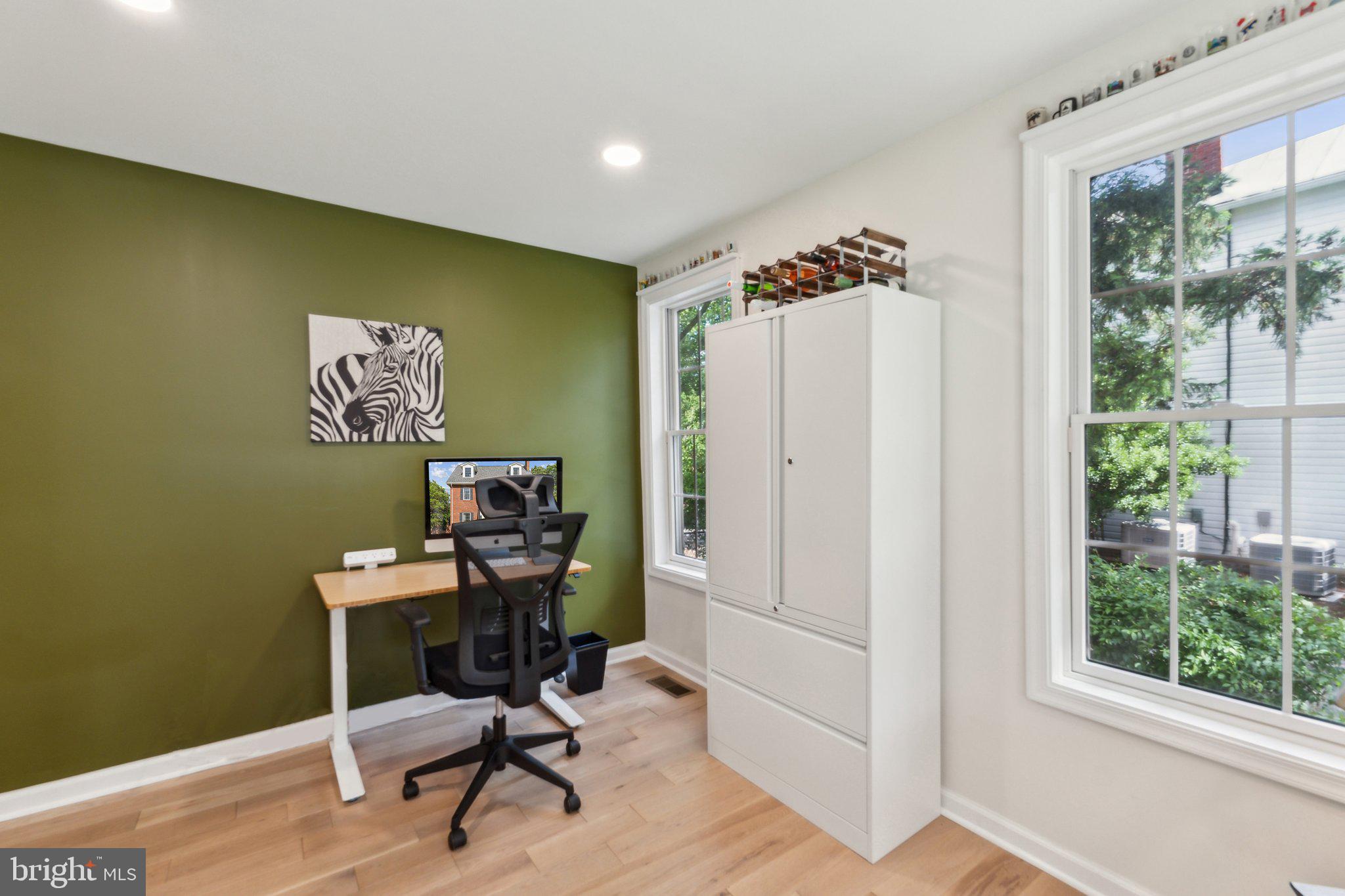 7401 Blair Road Northwest Washington, DC 20012 - Photo 15 of 42 a view of a workspace with furniture and a window