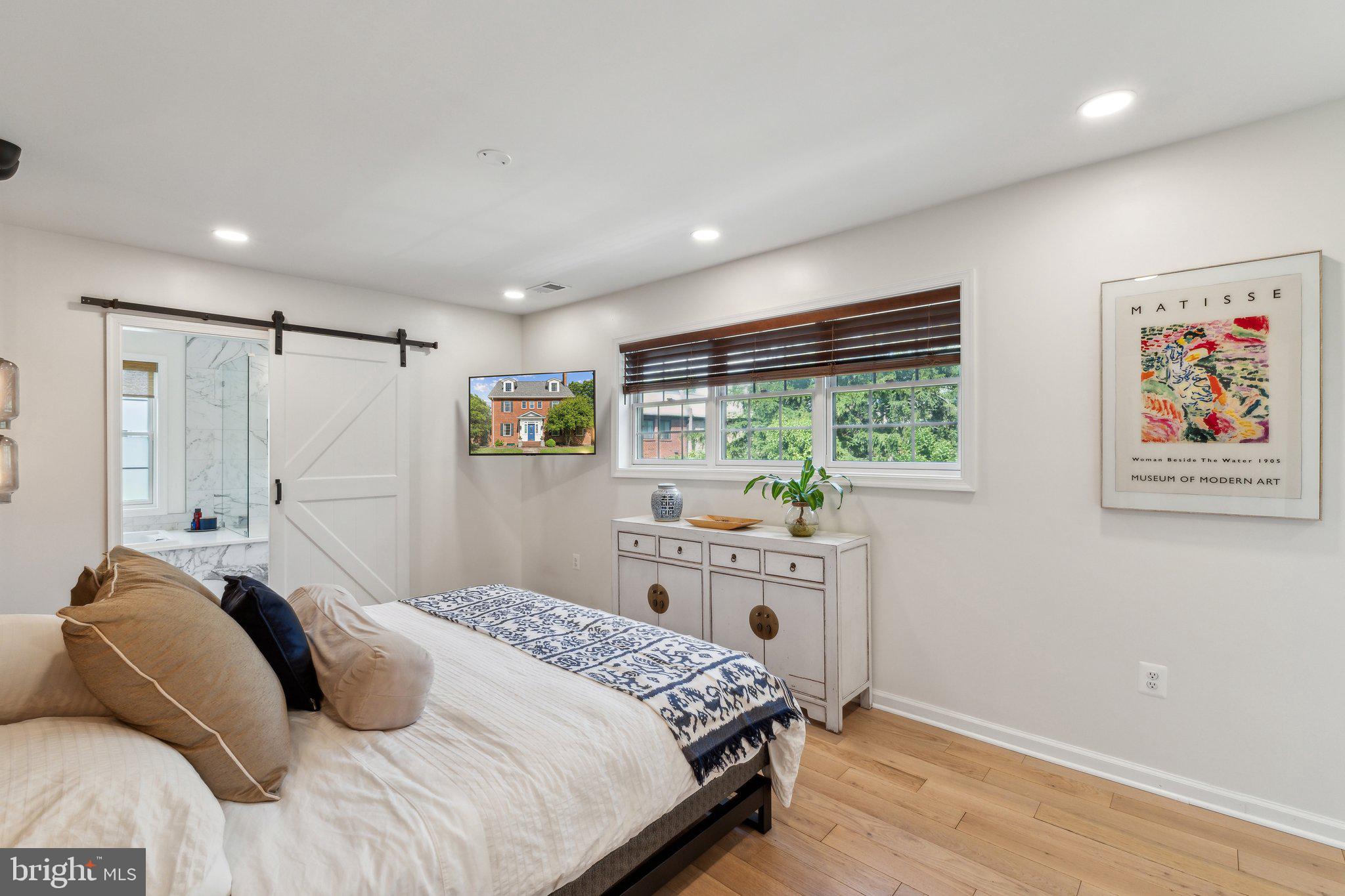 7401 Blair Road Northwest Washington, DC 20012 - Photo 18 of 42 a bedroom with a large bed and a window