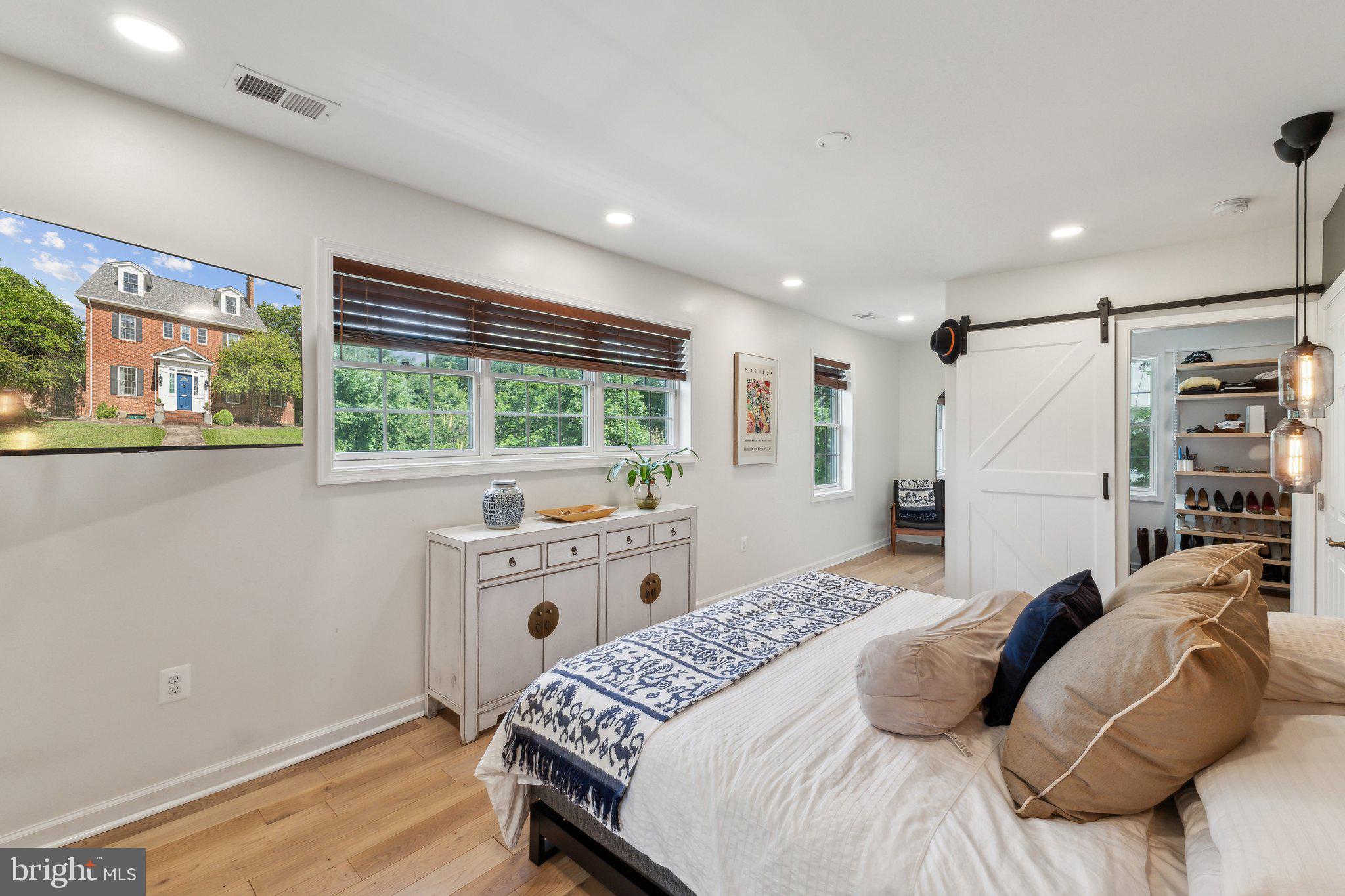 7401 Blair Road Northwest Washington, DC 20012 - Photo 20 of 42 a bedroom with a large bed and a window