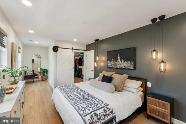 a bedroom with a bed and a table