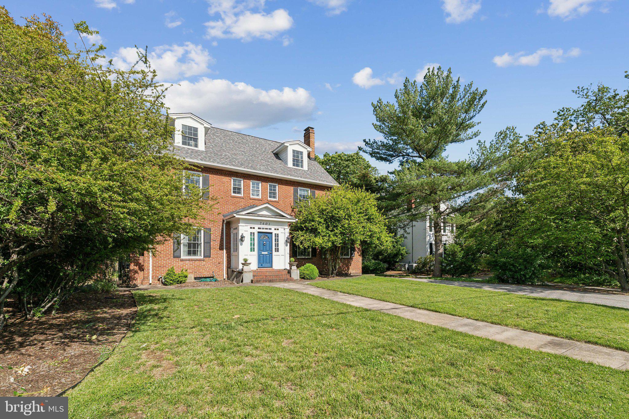 7401 Blair Road Northwest Washington, DC 20012 - Photo 3 of 42 a front view of a house with a yard