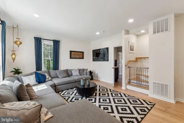 a living room with furniture and a rug
