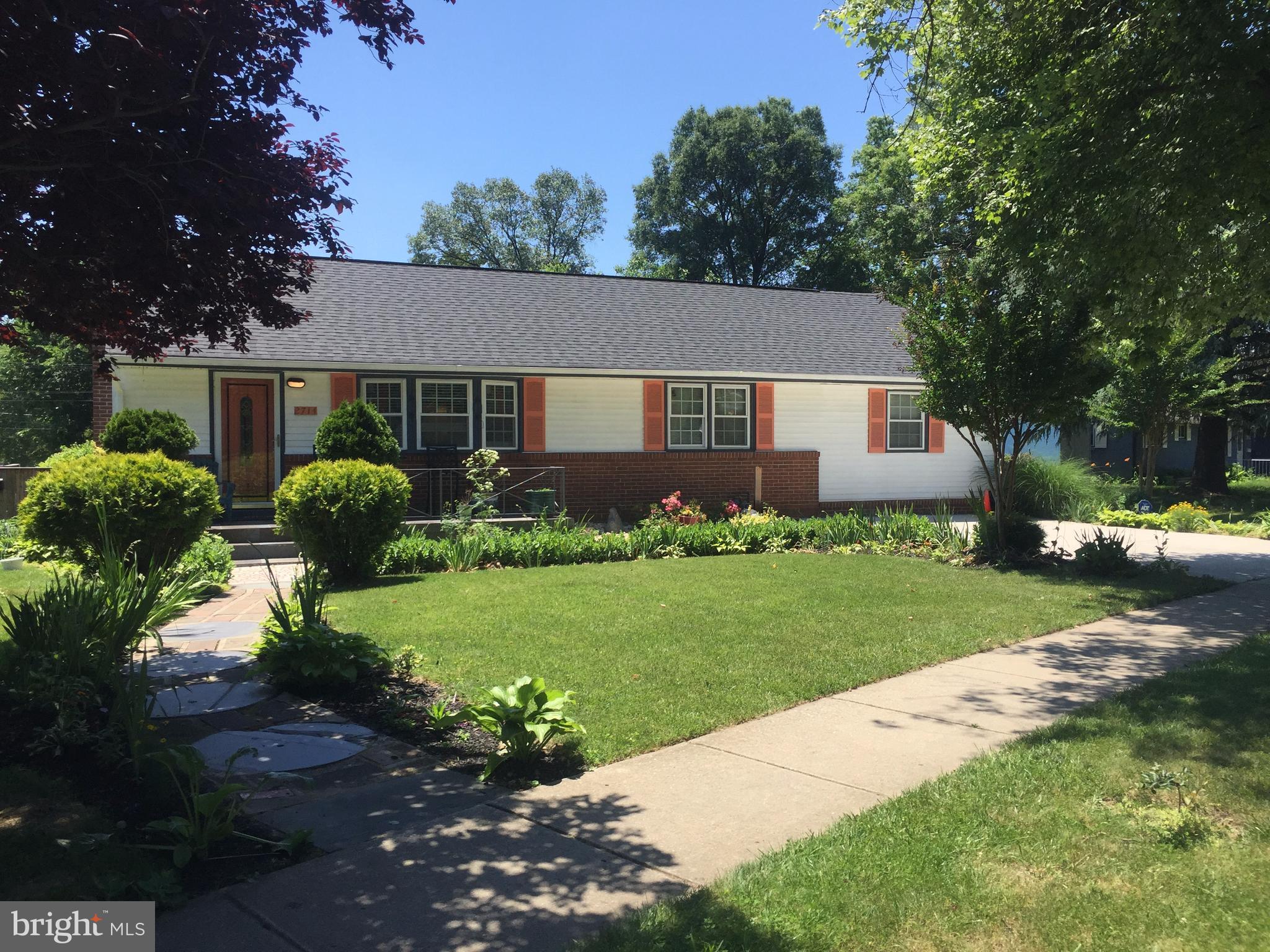 2714 Hughes Road Adelphi, MD 20783 - Photo 1 of 15 a view of a house with a yard and a garden
