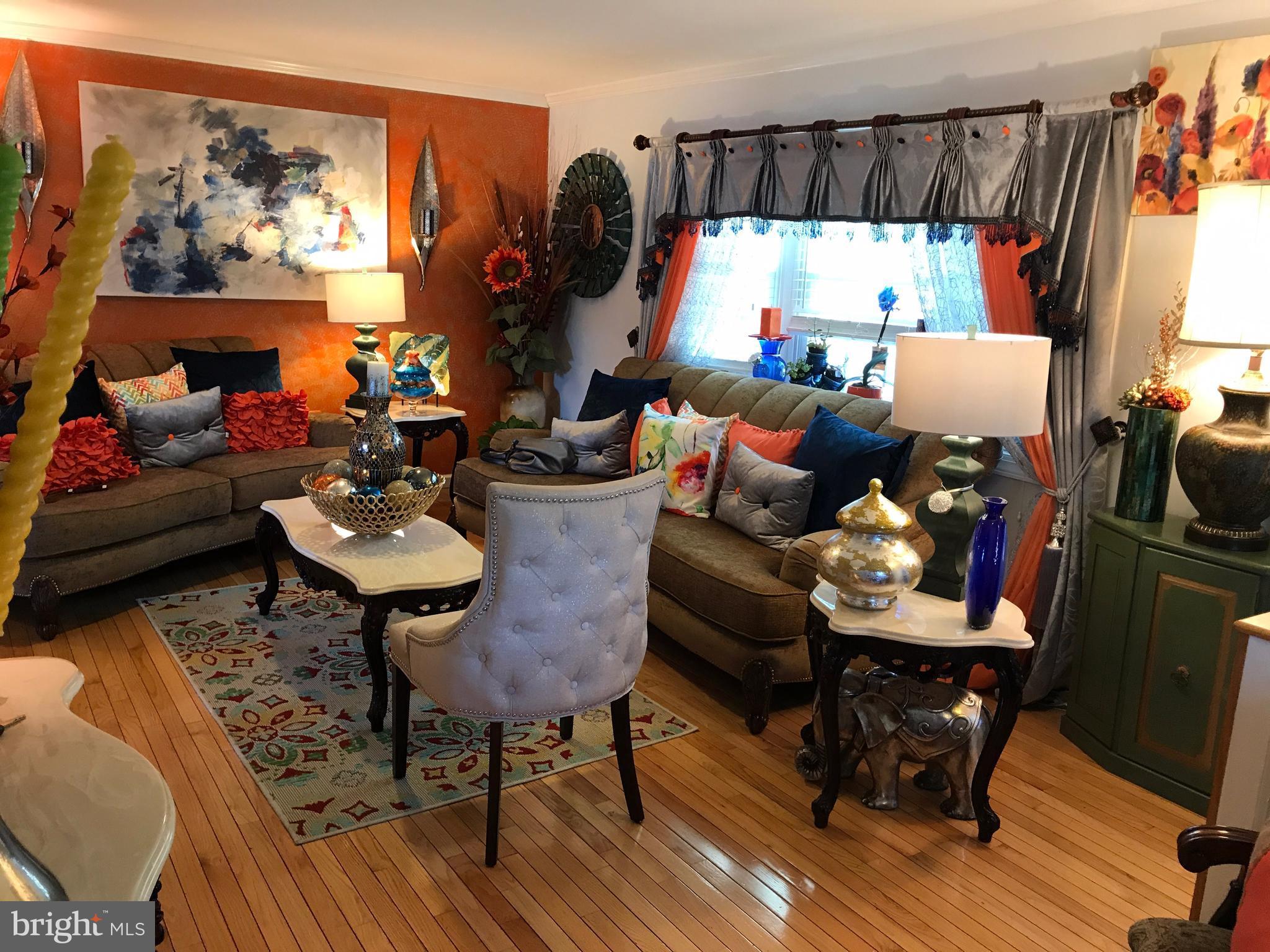 2714 Hughes Road Adelphi, MD 20783 - Photo 2 of 15 a bed room with furniture and a window