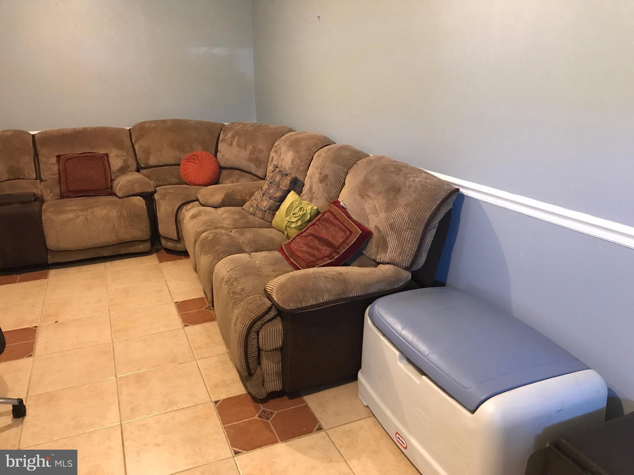 2714 Hughes Road Adelphi, MD 20783 - Photo 12 of 15 a living room with couches and a rug