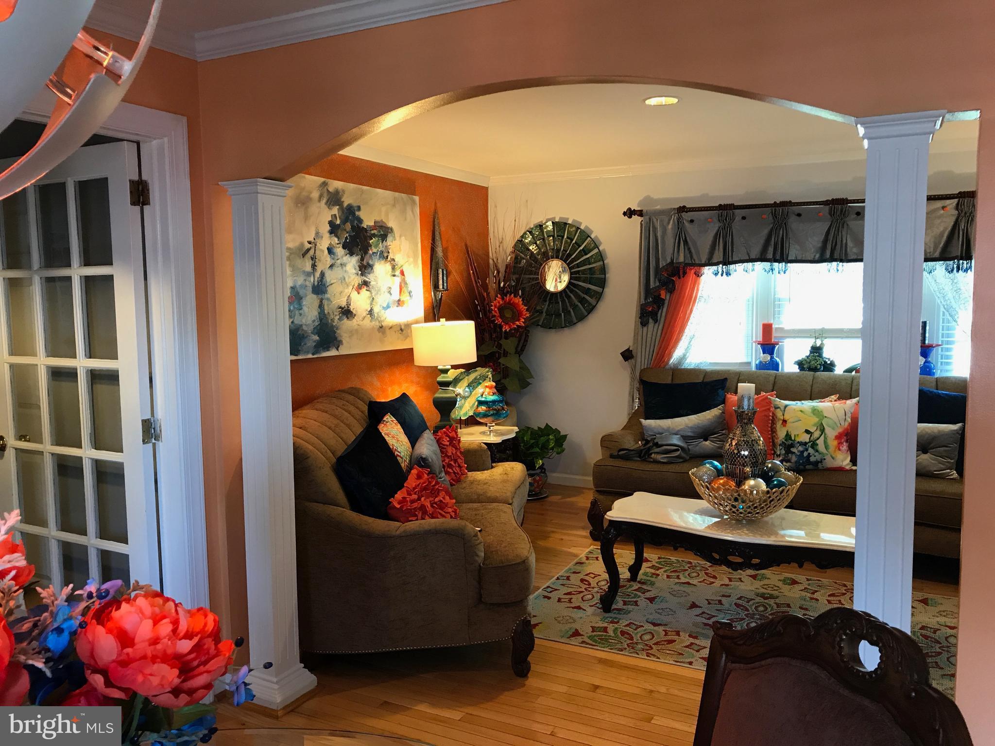 2714 Hughes Road Adelphi, MD 20783 - Photo 6 of 15 a living room with furniture and a floor to ceiling window