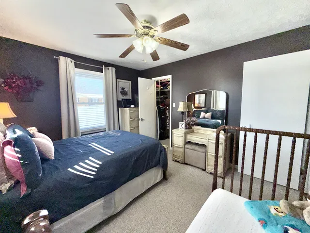 a bed room with a bed and a television